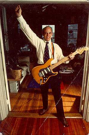 Photo of Fender Guitars Founder, Leo Fender playing a Stratocaster