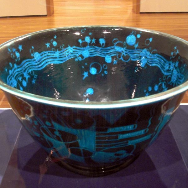 Black and blue punch bowl with colorful drawings