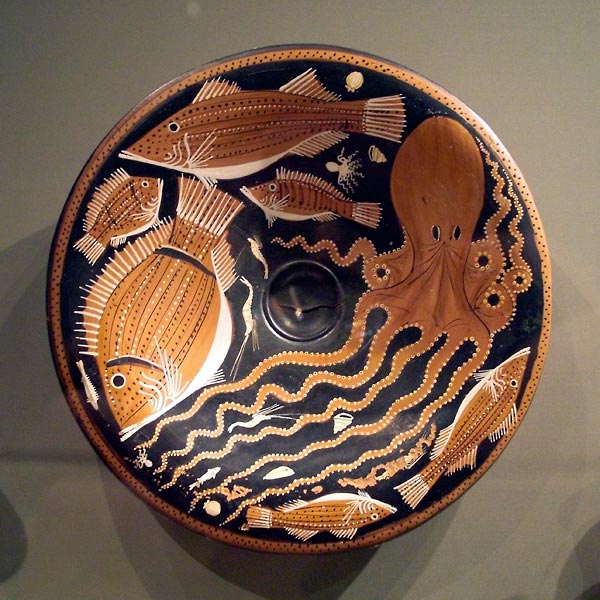 Egyptian plate with colorful drawings of fish and octopus