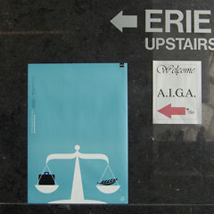 Poster for AIGA Student Portfolio Review on wall.