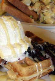 Waffles with blueberries and whipped cream