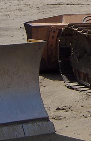 Dozer blades on beach