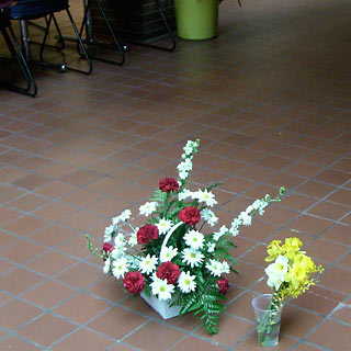 Bouquets of flowers on floor 