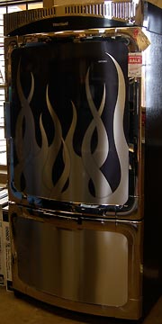 Big refrigerator with chrome-plated  flames on the door