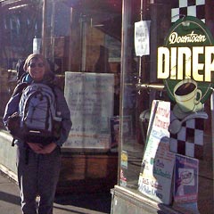 Joanne with packs in front of Downtown Diner, Flagstaff