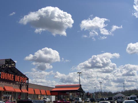 White  clouds, blue sky over Home Depot