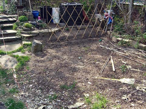 Garden looking toward compost heap, nothing growing yet