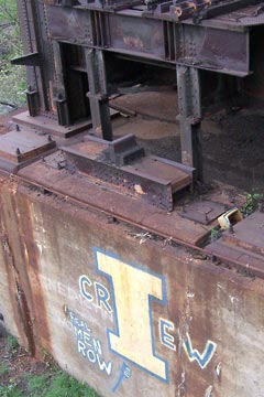 Base of old railroad bridge in Flats with "Ignatius Crew" painted on it