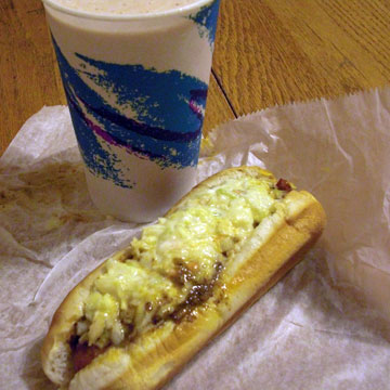 Chocolate shake and slaw dog on table