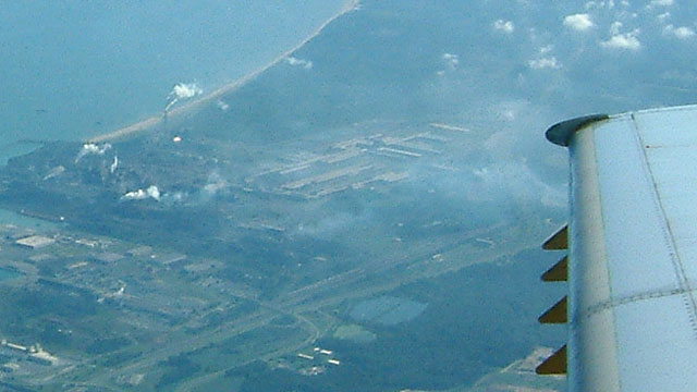 Looking out plane window towards shore