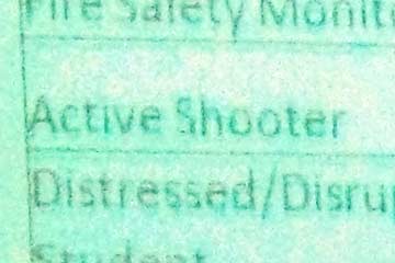 Close-up of screen with words active shooter visible