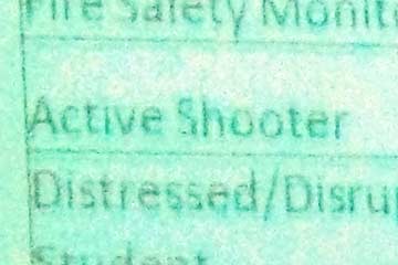 Close-up of screen with words active shooter visible