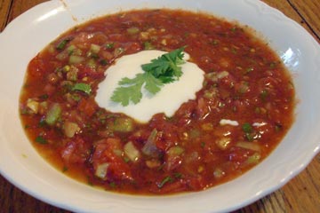 White bowl with red tomato-based Moroccan soup