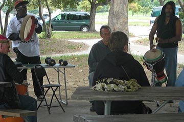 Drum circle playing in Edgewater lower  pavilion