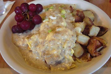 Plate of biscuits with eggs and sausage gravy at Lucky's