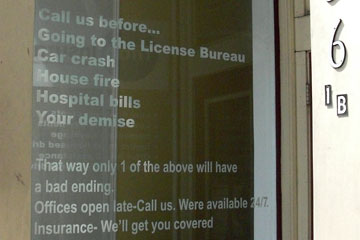 Lettering on window of insurance agency