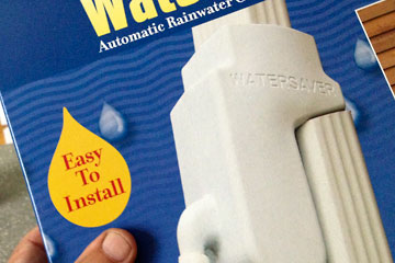 Rainbarrel diverter box label says 'easy to install'