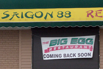 Sign saying the Big Egg Restaurant will reopen