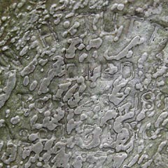 Detail of severely eroded carved stone