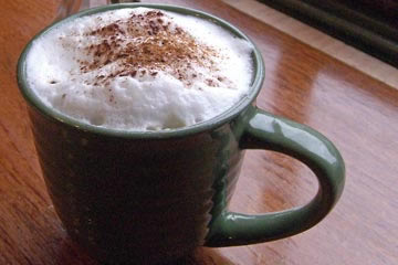 Cappuccino in green ceramic cup