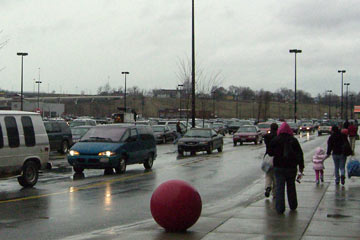 Groups of people and cars in Steelyard Commons shopping center