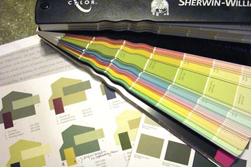 Paint samples and swatch book on countertop