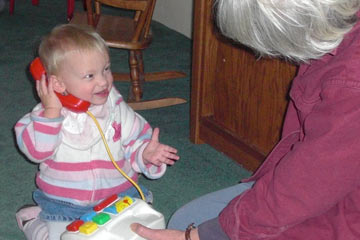 Jocie on toy phone