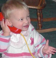 Baby holding toy phone