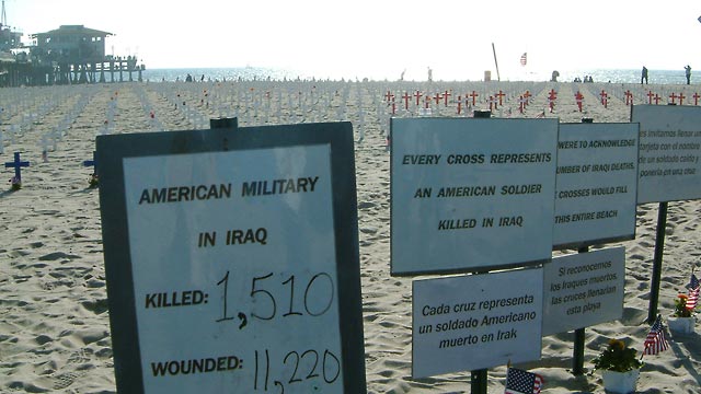 Santa Monica beach with crosses and signs representing American soldiers who died