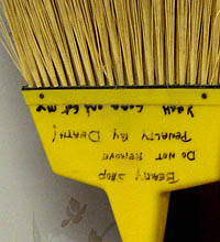Broom with threat written on it