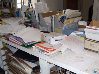 Desk cover with papers.