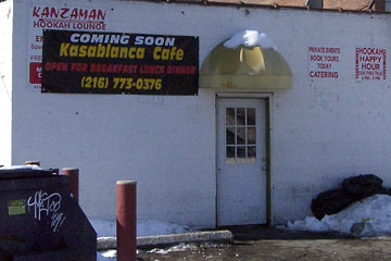 Back door to Kan Zaman restaurant with sign  announcing Kasablanca Cafe.