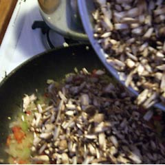 Adding mushrooms to  pan