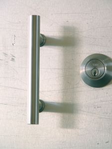 Curved loop metal door handle