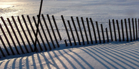 Snow fence and shadows