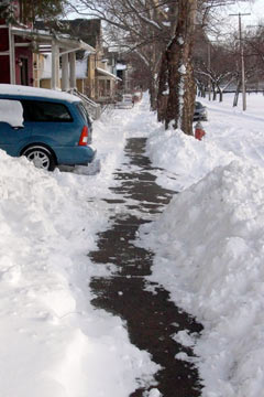 Snow shoveled off sidewalk