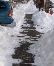 Snow and a clear sidewalk