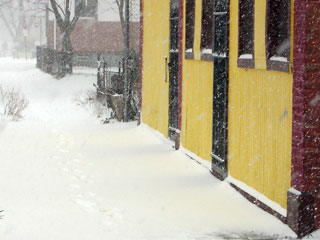 Yellow reflection on snow in front of Buddhist temple