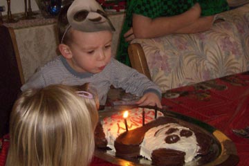 Sammy blowing out candles