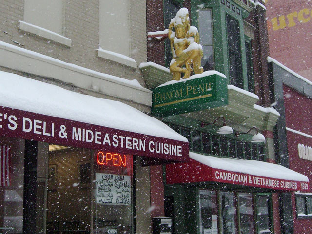 Snow-covered sign for Phnom Penh restaurant