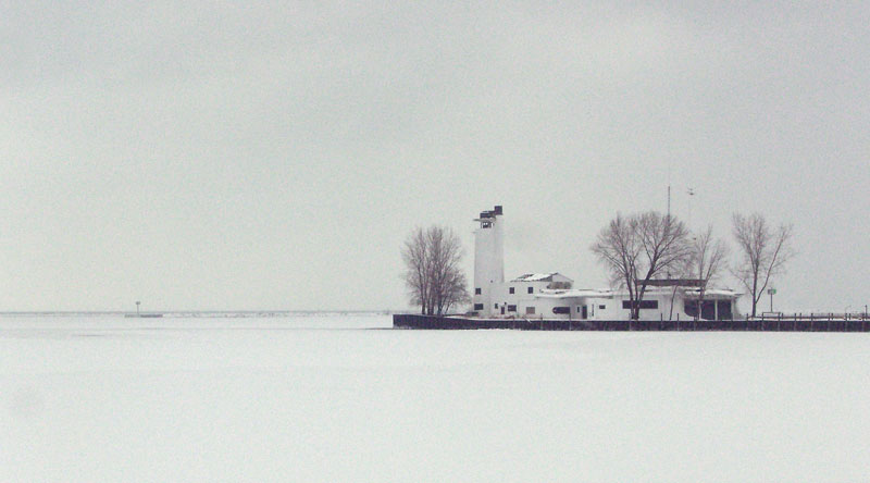 Near white-out on Lake Erie looking towards old Coast Guard station at mouth of Cuyahoga River