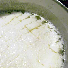 Curds and whey in pot