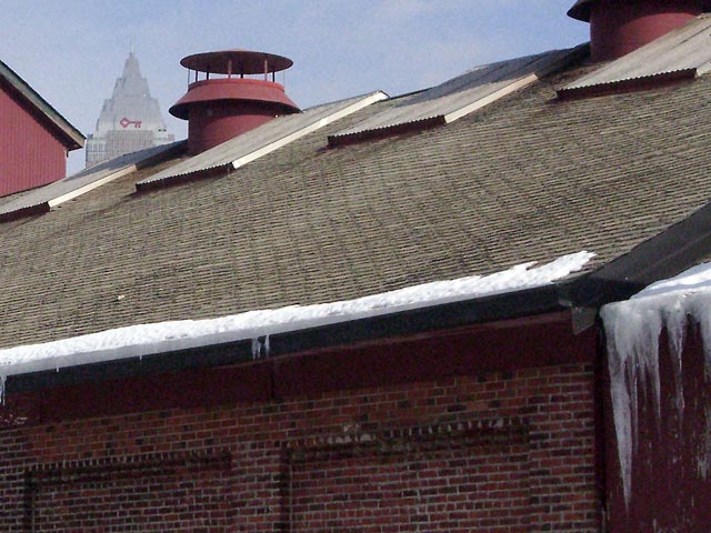Roof with red vent, blue sky