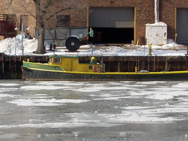 Yellow-trimmed boat on Cuyahoga River