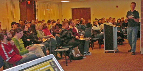 Eric Meyer speaks to a large crowd at Cuyahoga Community College