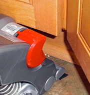 Dyson vacuum bumping into cabinet