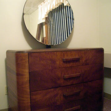 Old dresser with round mirror