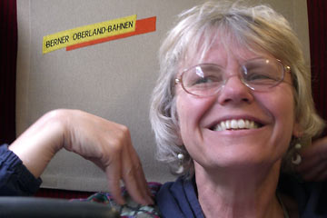 Joanne sitting on the Berner Oberland-Bahnen train