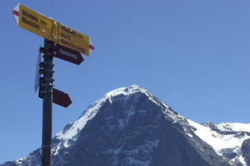 Trail sign with Eiger in the background
