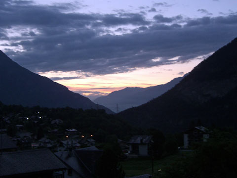 Orange-pink clouds at dawn, looking East toward Rhone Valley